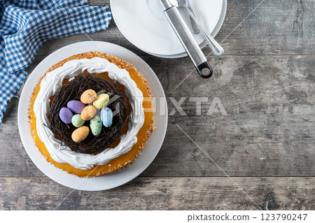 Homemade Easter egg cake on wooden table Homemade Easter egg cake on wooden table 123790247