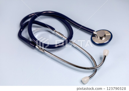 Medical stethoscope on blue background. World heart day. 123790328