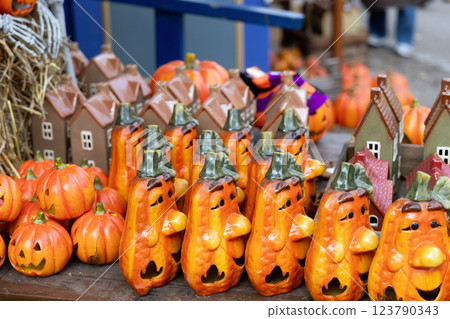 Halloween souvenirs and funny pumpkins and houses in a small shop 123790343