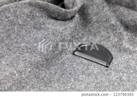 Grey cashmere scarf and brush for wool and cashmere care Grey cashmere scarf and brush for wool and cashmere care 123790385