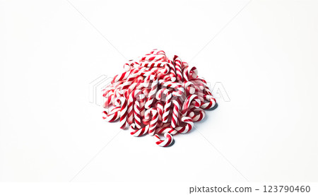 A small pile of neatly rearranged red and white striped candy canes viewed from a slightly elevated angle on a plain white background. This organized heap highlights the candy canes' colorful and 123790460