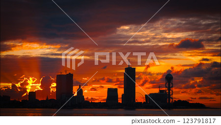 Batumi, Adjara, Georgia. View From Sea Beach To Cityscape With Modern Urban Architecture, Skyscrapers And Tower. Embankment At Sunset Sunrise. Bright Evening Sky In Yellow, Orange And Red Colors 123791817