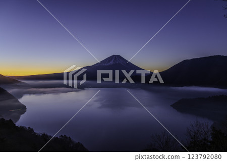 Mount Fuji, illuminated in the magic hour before dawn, seen from Lake Motosu Nakanokura Pass Observation Point Mount Fuji, illuminated in the magic hour before dawn, seen from Lake Motosu Nakanokura Pass Observation Point 123792080