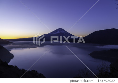Mount Fuji, illuminated in the magic hour before dawn, seen from Lake Motosu Nakanokura Pass Observation Point Mount Fuji, illuminated in the magic hour before dawn, seen from Lake Motosu Nakanokura Pass Observation Point 123792082