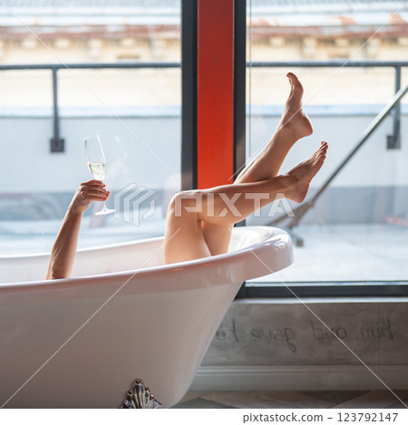 Woman feet in bathrobe at home, closeup Woman feet in bathrobe at home, closeup 123792147