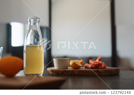 Crab legs with lemon and dressing on olive woob board Crab legs with lemon and dressing on olive woob board 123792148