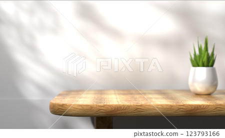 Wooden table surface, empty backdrop for product placement, simple and clean space, neutral background, bright and natural light, modern workspace design, advertising backdrop 123793166
