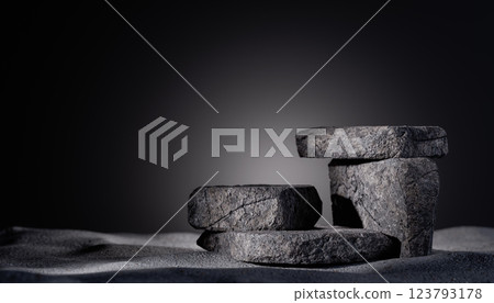 Empty stone podium for product placement, natural rock background, minimalist display, textured surface, dark gradient backdrop, rustic stone platform, studio lighting, modern presentation 123793178