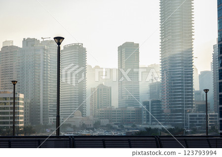 Smog fog in the city from car exhaust gases, multi-story buildings in a light haze 123793994