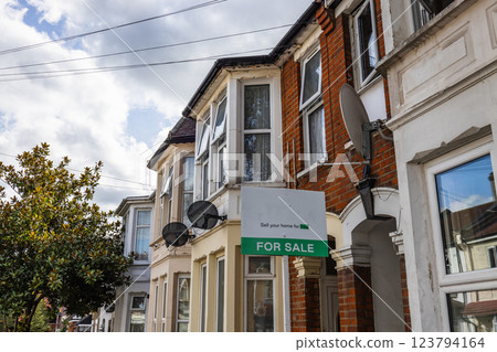 Victorian Houses and a Modern Estate Agent Sign 123794164
