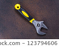 Adjustable wrench versatile tool for gripping and twisting 123794606
