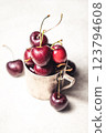 Cherry-filled metal cup 123794608