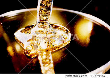 Pipette with Golden gel on petri dish in light Pipette with Golden gel on petri dish in light 123794879