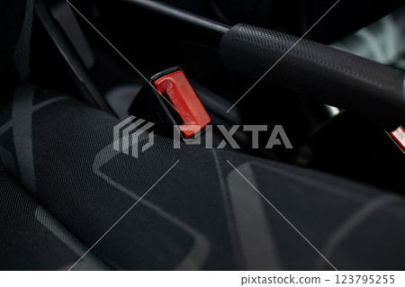 Car seatbelt buckle, close-up view. Car seatbelt buckle, close-up, red button. 123795255