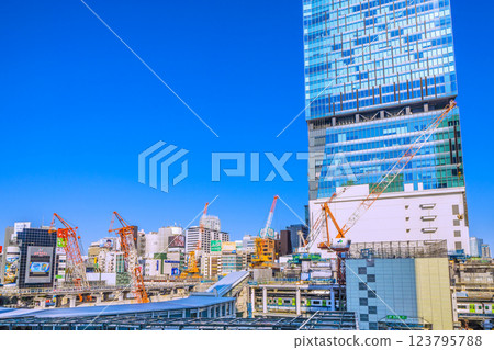Six cranes in the Tokyo cityscape of Japan... (supports cut). Farewell to the West Exit of Shibuya Station, the old Hachiko ticket gate in the back left. Roppongi, etc. in the back right. 123795788