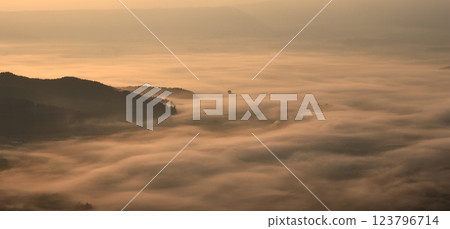 The sea of clouds stained in the morning sun The sea of clouds stained in the morning sun 123796714