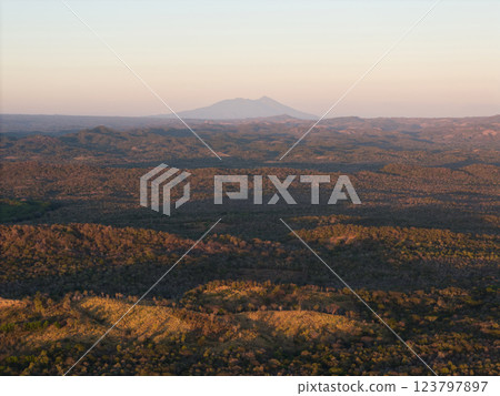 Majestic landscape showing rolling hills and distant mountains at sunset 123797897