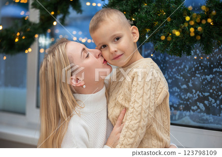 Mom and son in the interior of the Christmas room. Mom and son in the interior of the Christmas room. 123798109
