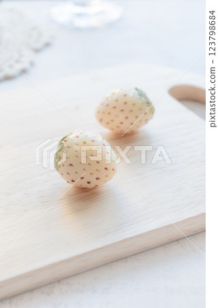 Strawberries on a cutting board, pearl white Strawberries on a cutting board, pearl white 123798684