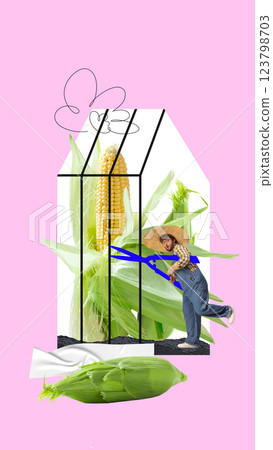 Man cutting massive corn stalk inside modern greenhouse design with pastel tones. Playful farming concept Man cutting massive corn stalk inside modern greenhouse design with pastel tones. Playful farming concept 123798703