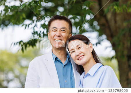 Senior couple cuddling with a smile 123798903