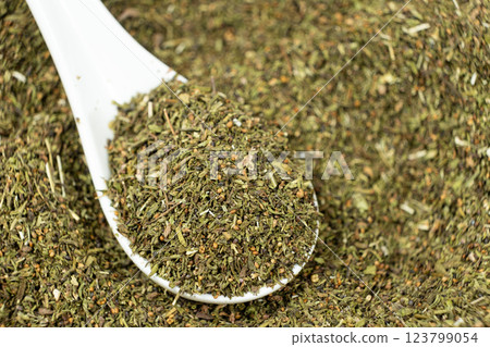 Savory herb seasoning in a spoon macro 123799054