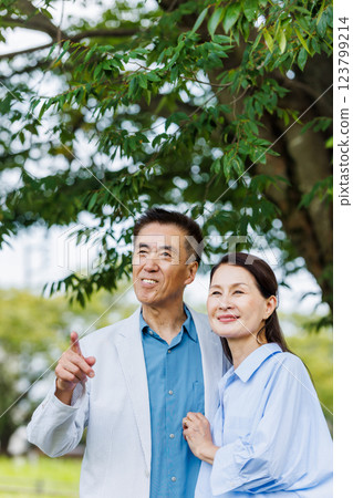 Senior couple cuddling with a smile Senior couple cuddling with a smile 123799214