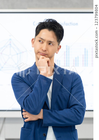 Male businessman thinking with a serious expression 123799804