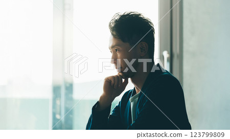 Male businessman thinking with a serious expression 123799809