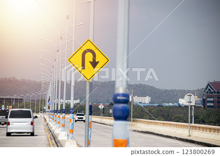 Sign showing the U-turn lane in front 123800269