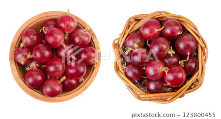 Red gooseberry in wooden bowl and wicker basket isolated on white background. Top view. Flat lay. 123800455