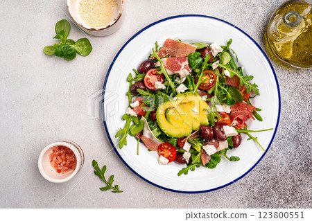 Green salad with avocado, salad leaves and jamon serrano or prosciutto Green salad with avocado, salad leaves and jamon serrano or prosciutto 123800551