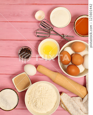 Recipe with eggs, flour, sugar, honey, cinnamon, yeast and butter. Kitchen background of cooking. Culinary ingredients for making pie and bread, Modern bakery concept Recipe with eggs, flour, sugar, honey, cinnamon, yeast and butter. Kitchen background of cooking. Culinary ingredients for making pie and bread, Modern bakery concept 123801442