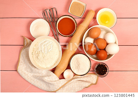 Recipe with eggs, flour, sugar, honey, cinnamon, yeast and butter. Kitchen background of cooking. Culinary ingredients for making pie and bread, Modern bakery concept Recipe with eggs, flour, sugar, honey, cinnamon, yeast and butter. Kitchen background of cooking. Culinary ingredients for making pie and bread, Modern bakery concept 123801445