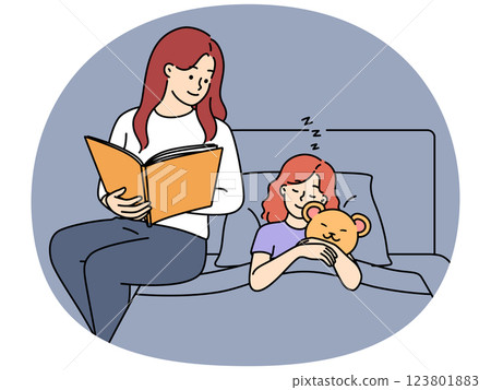 Loving mother read book to daughter in bed Loving mother read book to daughter in bed 123801883