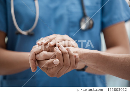 Hand holding, staff and hospital community with trust, support and hope in a clinic. Healthcare nurse, medical doctor and workers hands together to show work solidarity and team comfort care Hand holding, staff and hospital community with trust, support and hope in a clinic. Healthcare nurse, medical doctor and workers hands together to show work solidarity and team comfort care 123803012