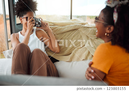 Girl friends, road trip and with camera in van for vacation pose in vehicle on holiday together have fun, bonding and smile. Photograph, women and being happy relax, enjoy travel and weekend getaway. 123803155