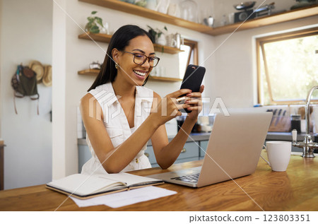 Remote work, home and business woman with phone for communication, connection and typing while smile, happy and relax. Entrepreneur, excited and with laptop for planning, startup company or strategy. Remote work, home and business woman with phone for communication, connection and typing while smile, happy and relax. Entrepreneur, excited and with laptop for planning, startup company or strategy. 123803351