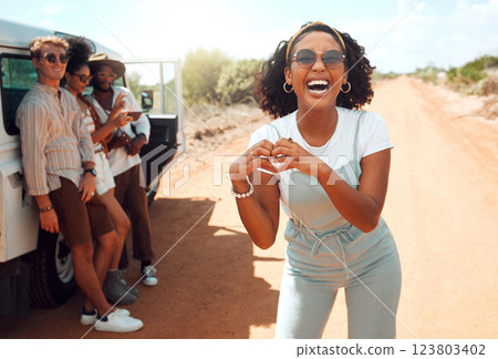 Heart, hands and black woman with love for road trip with friends in the countryside of California. Portrait of an African girl on safari holiday with people with support for adventure in the desert 123803402