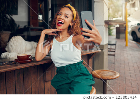 Selfie, phone and coffee shop with a black woman taking a photograph for social media post. 5g mobile technology, cafe and app with a female customer taking a picture at an outdoor restaurant 123803414