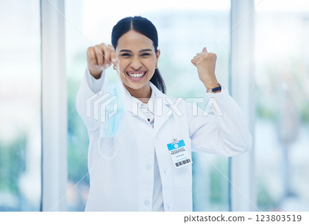 Doctor, happy and celebration with mask off face for end of covid 19, pandemic and coronavirus. Woman, medic and smile in hospital, clinic or healthcare cheering for stop of virus, bacteria or germs Doctor, happy and celebration with mask off face for end of covid 19, pandemic and coronavirus. Woman, medic and smile in hospital, clinic or healthcare cheering for stop of virus, bacteria or germs 123803519