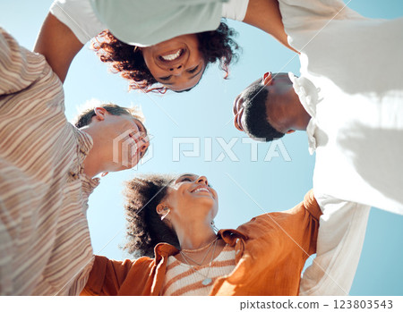 Huddle, happy and friends with support, love and smile in summer against blue sky. Diversity in group of people in solidarity, trust and happiness with hug, comedy and faith in circle from below Huddle, happy and friends with support, love and smile in summer against blue sky. Diversity in group of people in solidarity, trust and happiness with hug, comedy and faith in circle from below 123803543