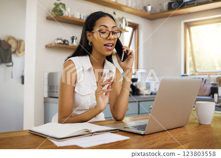 Woman, phone and laptop on talk for remote work with notebook in communication, phone call or conversation. Girl, talking and working on internet in marketing, social media or SEO with tech in home Woman, phone and laptop on talk for remote work with notebook in communication, phone call or conversation. Girl, talking and working on internet in marketing, social media or SEO with tech in home 123803558