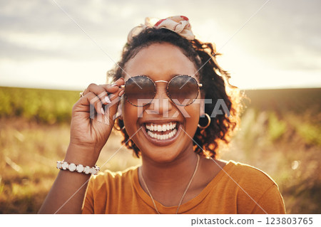 Happy, freedom and black woman with smile on a safari during a holiday in Africa. Face portrait of an African girl with sunglasses in summer during travel in nature for vacation or adventure Happy, freedom and black woman with smile on a safari during a holiday in Africa. Face portrait of an African girl with sunglasses in summer during travel in nature for vacation or adventure 123803765