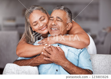 Happy senior couple, hug and relax in love for relationship bonding together in tender happiness at home. Joyful elderly man and woman smile in hope embracing romance for retirement house on sofa 123803826