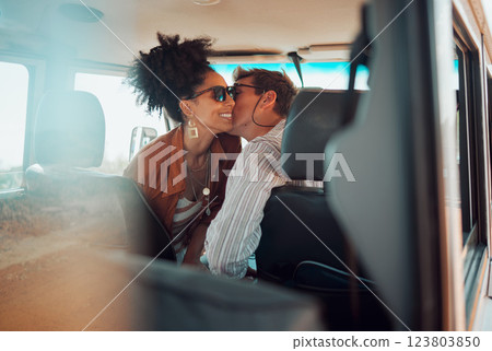 Love, couple and cheek kiss on road trip, vacation or summer holiday trip. Sunglasses, diversity and man kissing woman, affection or bonding, care or romance on car drive and spending time together. 123803850