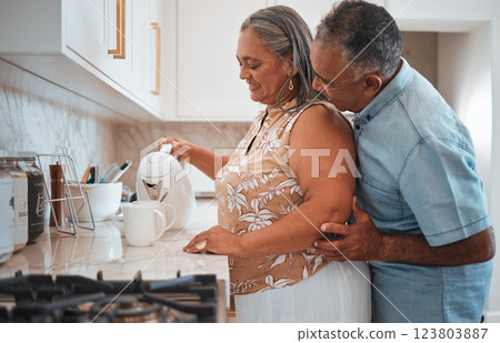 Love, hug and senior couple smile in kitchen with coffee, talking and together in morning. Happy family, relax and retirement by elderly man and woman enjoy conversation, care and pension lifestyle 123803887