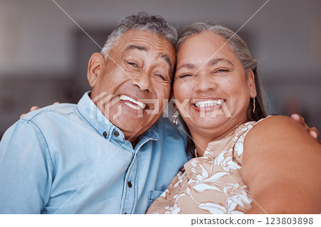 Happy senior couple, portrait smile and relationship bonding together in joyful happiness at home. Man and woman smiling for retirement in love and care for romantic time and relax at the house Happy senior couple, portrait smile and relationship bonding together in joyful happiness at home. Man and woman smiling for retirement in love and care for romantic time and relax at the house 123803898