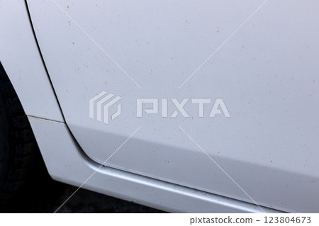 Iron powder attached to the body of a car 123804673