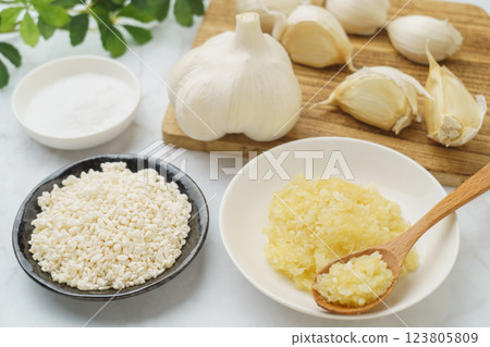 Garlic Koji and ingredients (garlic, rice koji, salt) | White marble background Garlic Koji and ingredients (garlic, rice koji, salt) | White marble background 123805809